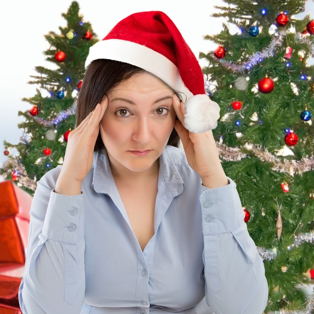 Stressed looking woman in Santa Hat